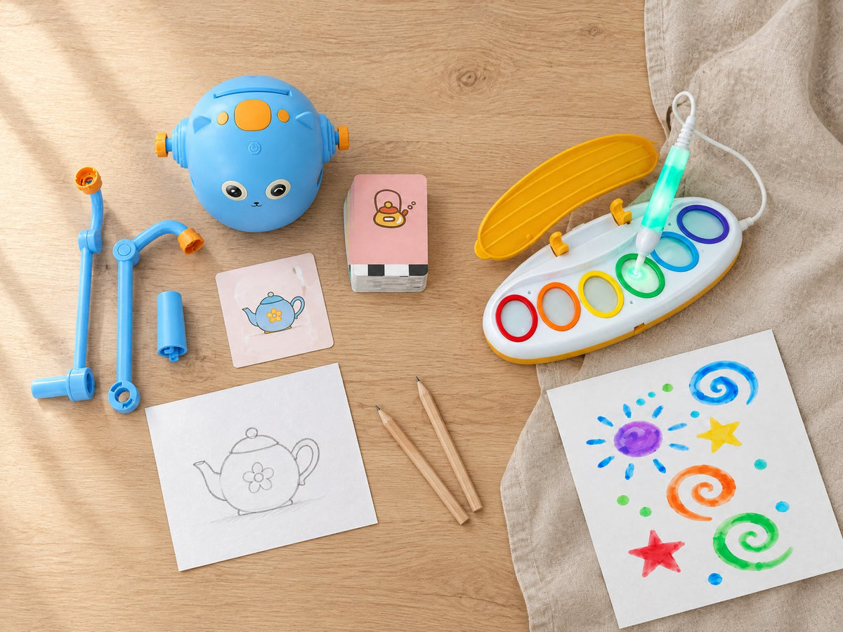 Drawing robot and light-up paint pen on an oak table
